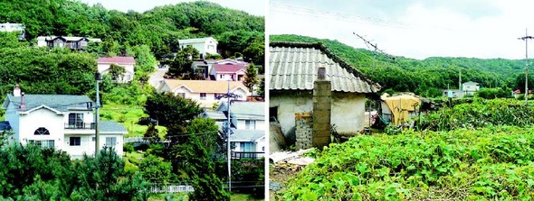 경기 김포시 월곶면 용강리 민통선 마을에서 작전지역 검문소를 경계로 30여m 거리를 두고 유럽풍 고급 전원주택(왼쪽)과 도시에서 밀려와 정착하게 된 이들이 살고 있는 허름한 슬레이트 지붕의 집(오른쪽)이 극명한 대조를 이룬다.