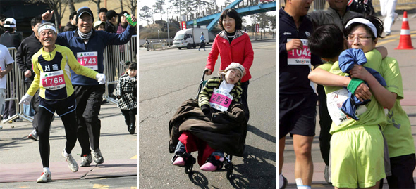 제2회 3·1절 마라톤대회가 1일 서울월드컵경기장에서 열려, 최고령 할아버지(왼쪽부터)·엄마와 함께 휠체어로 달리는 어린이·완주 기쁨을 나누는 모자 등이 기쁨을 만끽하고 있다. / 이종근 기자 <A href="mailto:root2@hani.co.kr">root2@hani.co.kr</A>