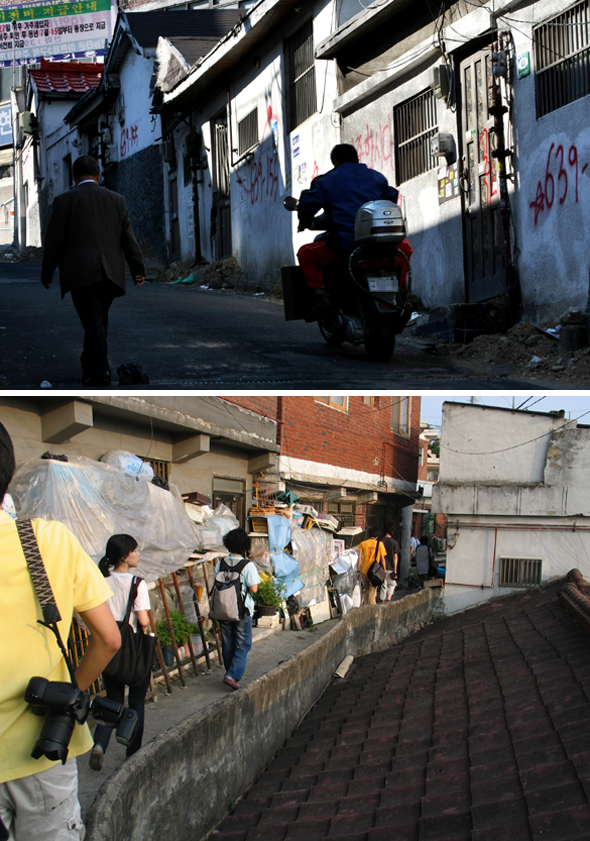  뉴타운과 재개발로 인해 과거의 도시 공간이 사라지고 있으나, 서울시와 구들은 사진 전시회와 표지석 등으로 과거 흔적을 보존하겠다고 밝히고 있다. 사진은 뉴타운 개발로 사라지는 아현동 거리와 북아현동의 골목길. 김진수 김경욱 기자