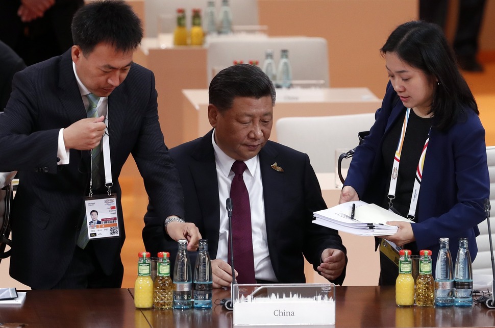 The Chinese President, Xi Jinping (C) arrives in the plenary session of the G20 summit in Hamburg, Germany, 08 July 2017. The G20 Summit (or G-20 or Group of Twenty) is an international forum for governments from 20 major economies. The summit is taking place in Hamburg 07 to 08 July 2017. EPA/FELIPE TRUEBA