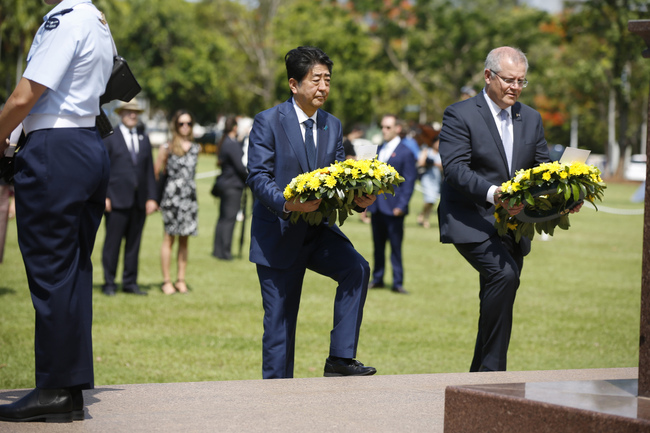 Japanese Prime Minister Shinzo Abe, alongside Australian Prime Minister Scott Morrison, presents a memorial service for the war dead in Darwin, in northern Australia. Darwin News / AFP