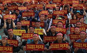 [한겨레 사설] 성과연봉제 폐지, 임금체계 개편으로 이어져야